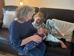 Claire with kids on the sofa