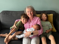 Claire with kids on the sofa